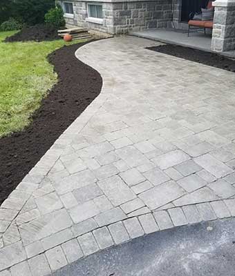 interlocking stone entrance pathway to front entrance of house