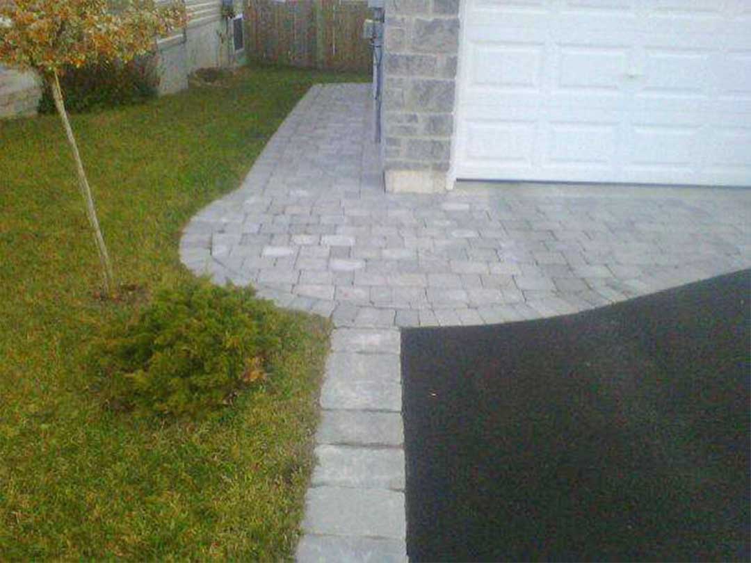 interlocking stone pathway and entrance to garage