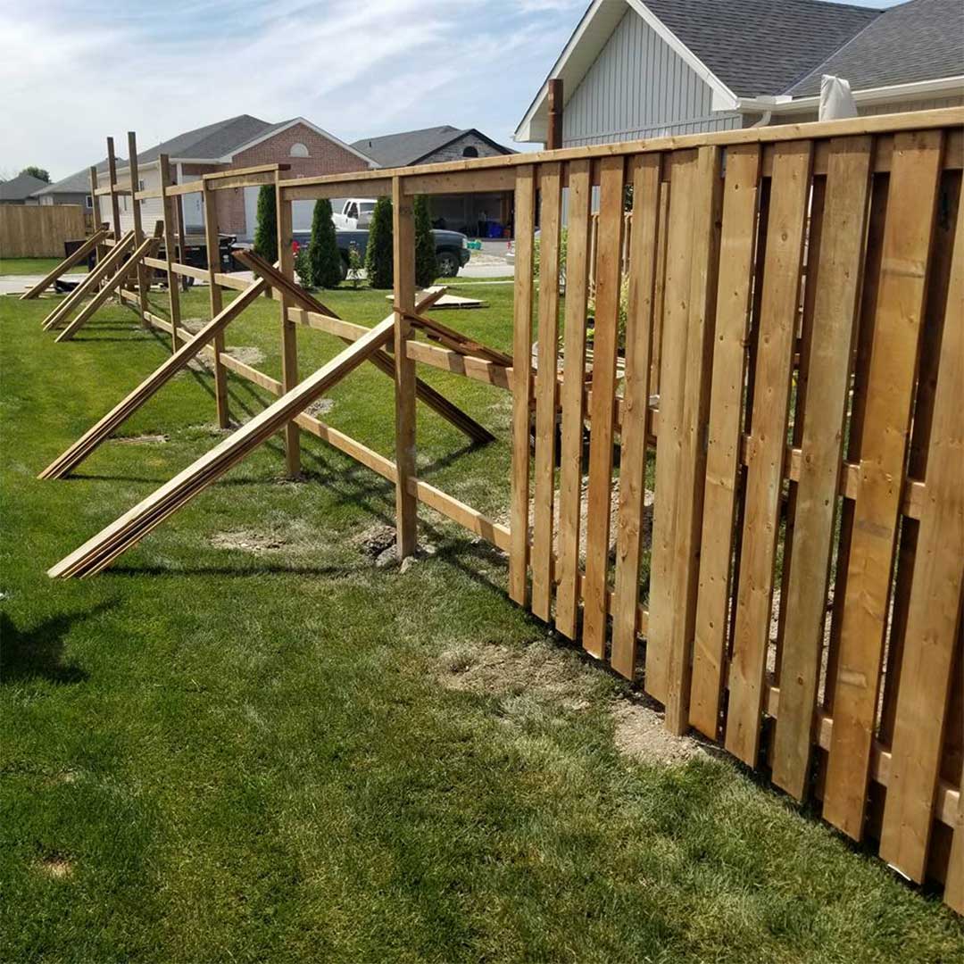 wooden fence being constructed