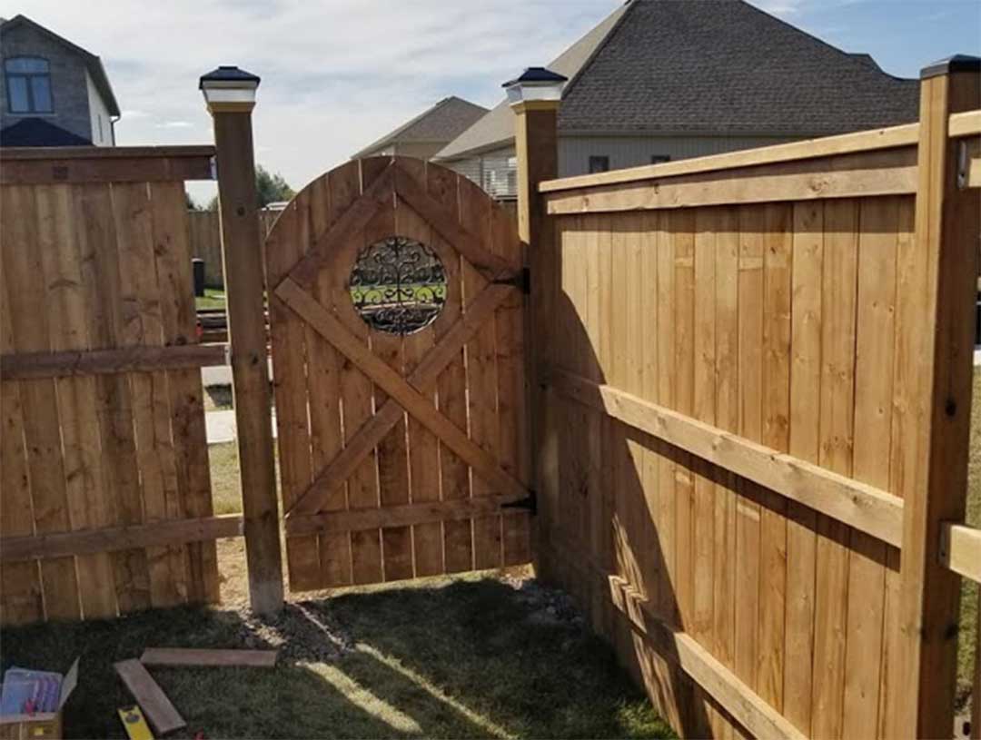 wooden fencing with gate being constructed