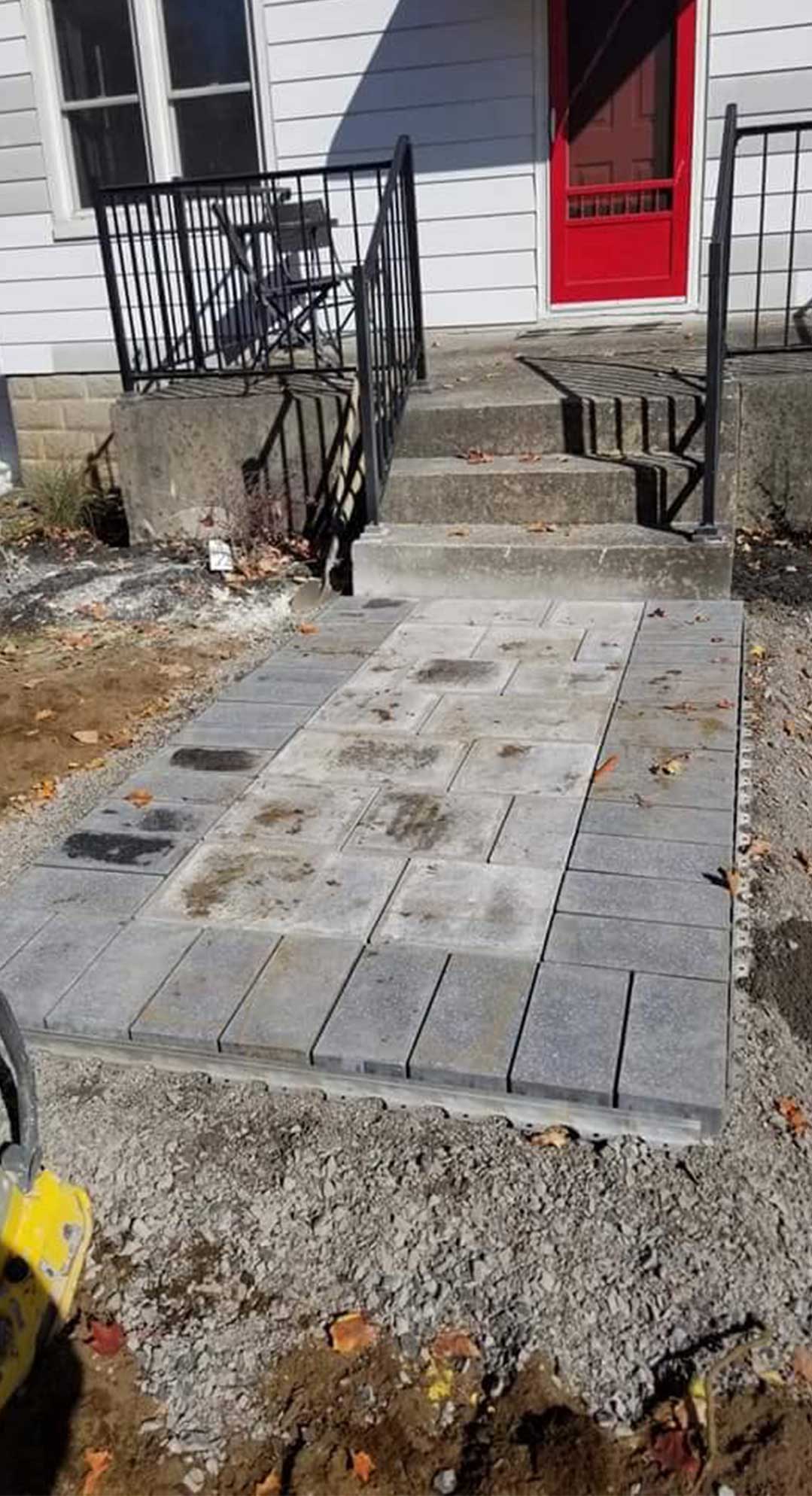 interlocking stone path leading to front door of residence