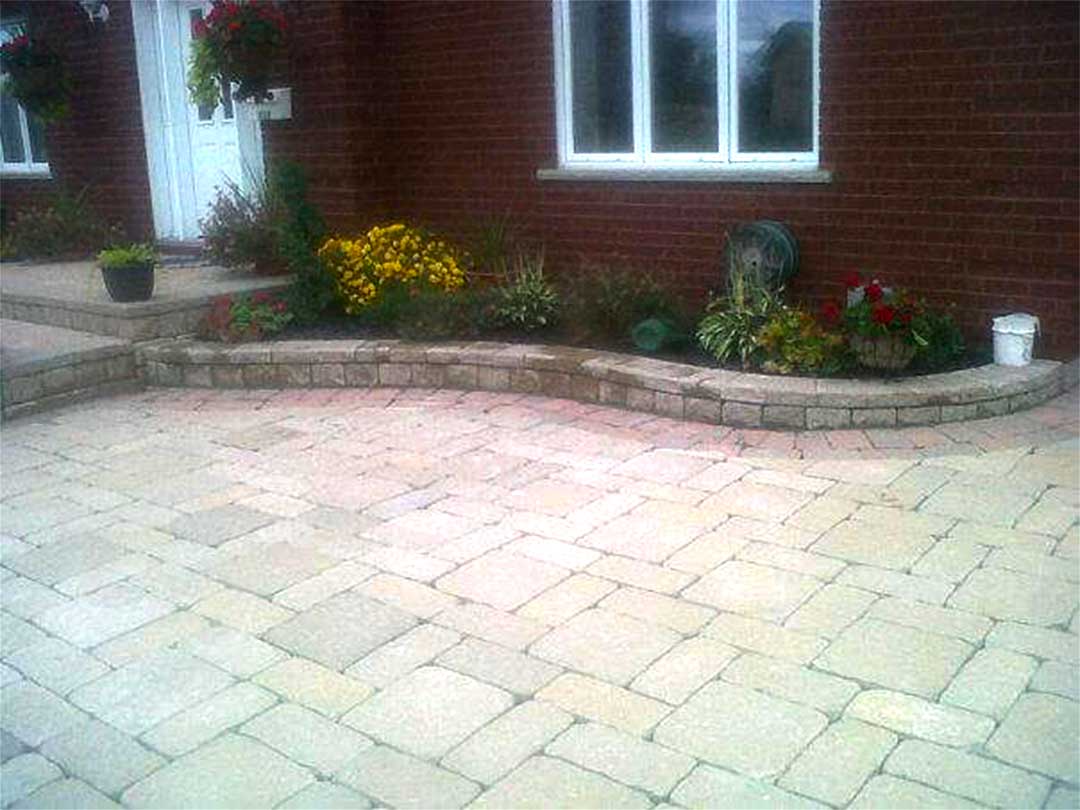 interlocking stone entrance with stone steps and retaining walls for garden