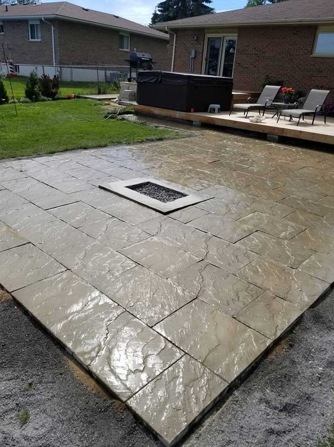 interlocking stone patio with fire burning area inset