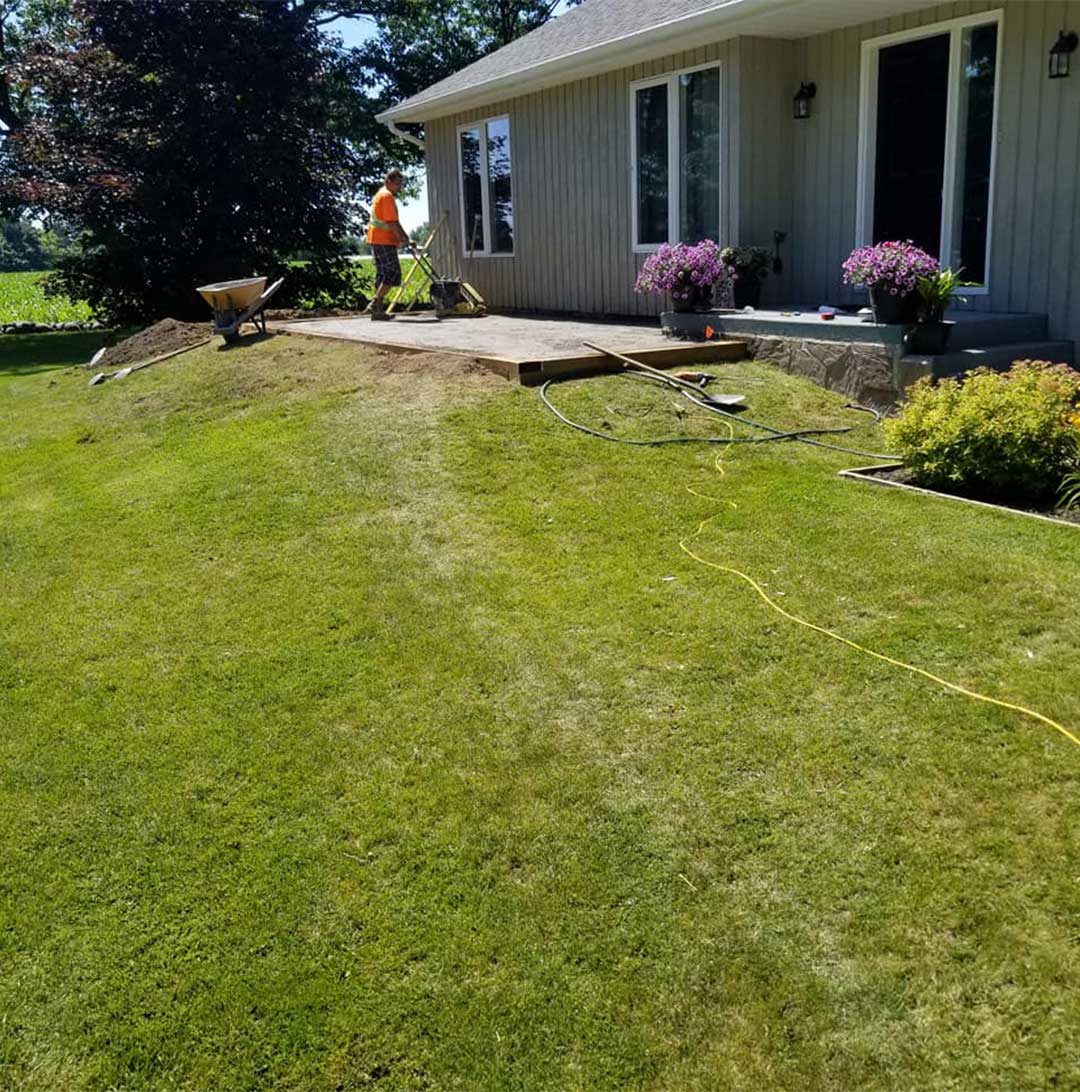 landscape construction of backyard with patio and gardens