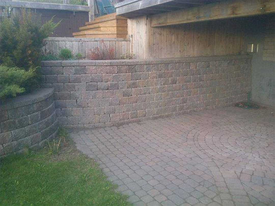 interlocking stone retaining walls and patio