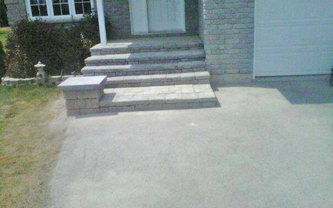 interlocking stone steps leading to front door of residence