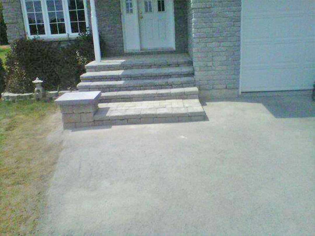 interlocking stone steps leading to front door of residence