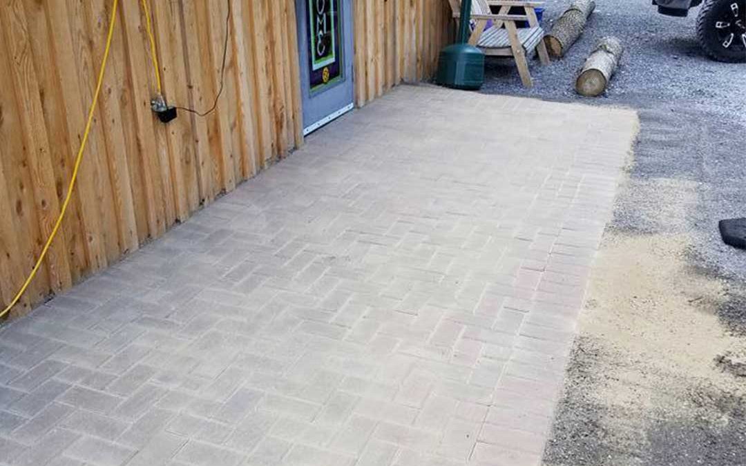 interlocking stone path leading to front door of business