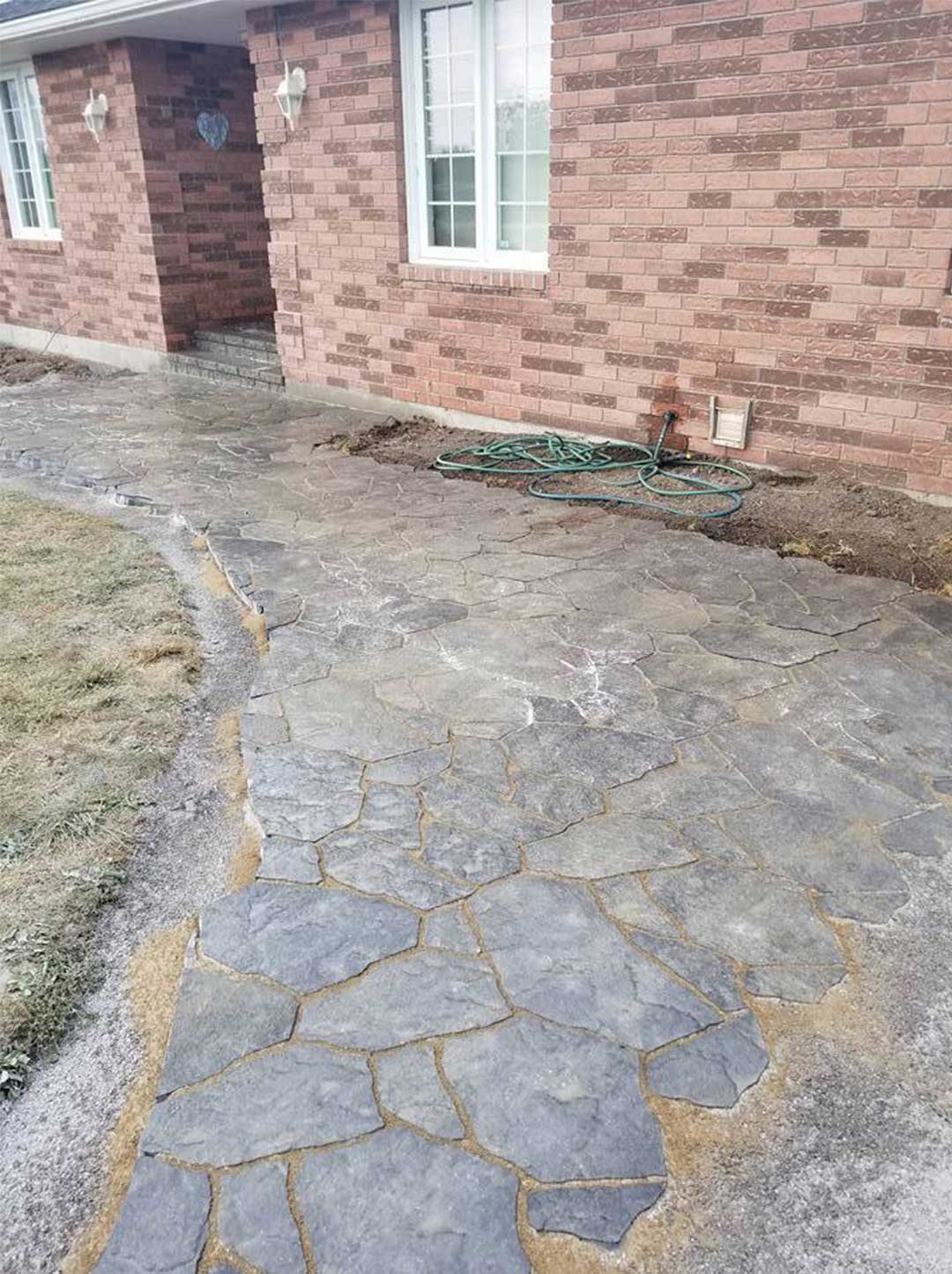 interlocking stone path leading to front door of residence